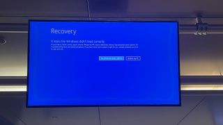 Kevin Addley, VP Marketing & Growth at Future photographs a BSOD at JFK airport